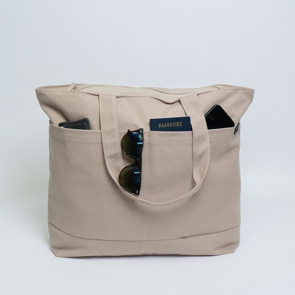 Travel tote bags with trolley sleeve