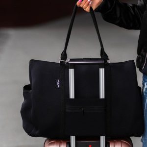 Travel tote with luggage sleeve